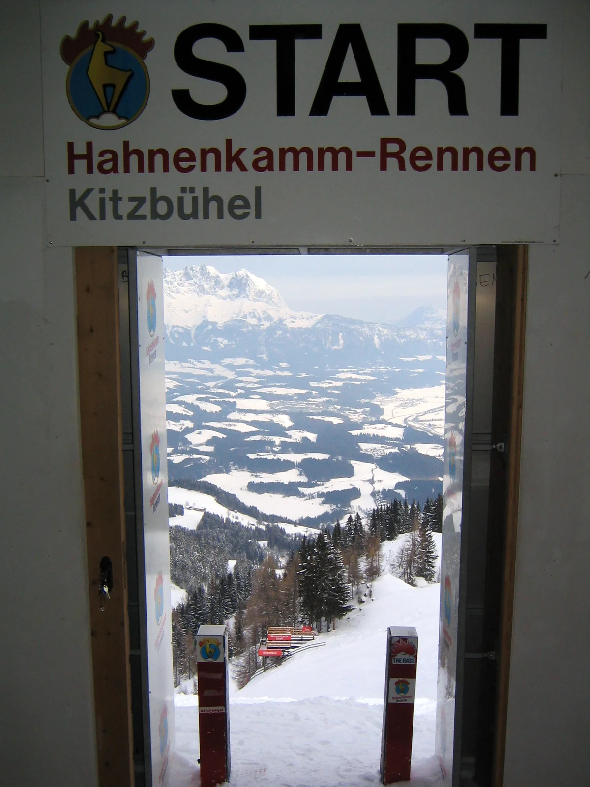 Wooden downhill race start building perched on the steep summit ridge of the Hahnenkamm mountain.