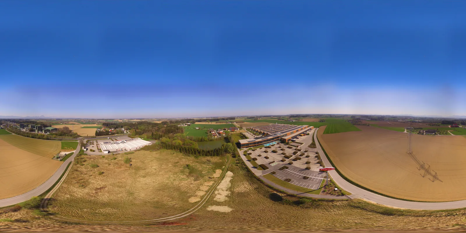 Expansive modern solar-powered industrial production halls and engineering logistics facility in Sattledt, Upper Austria.