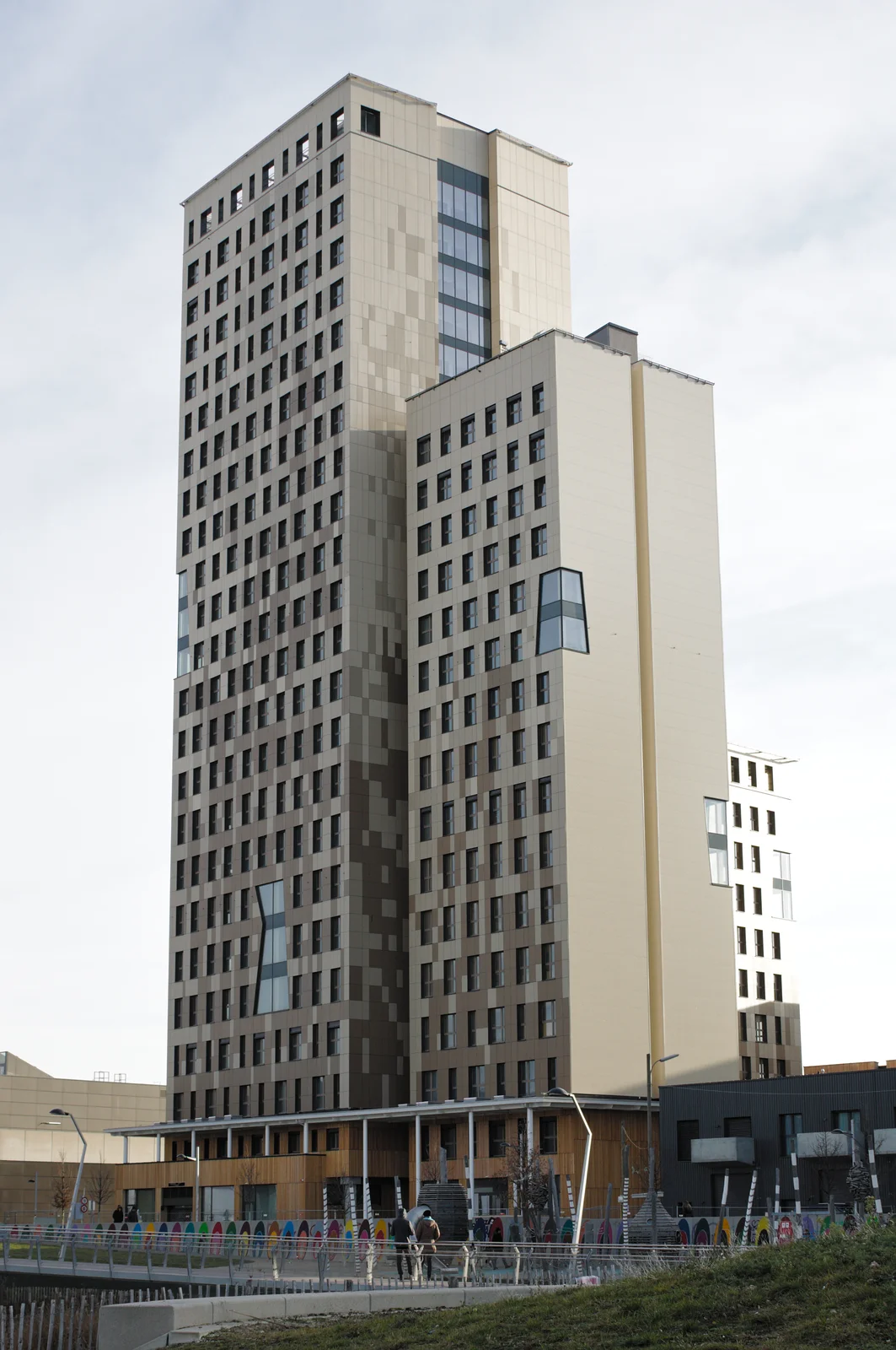 Modern multi-storey hybrid timber skyscraper rising into the sky in Vienna's Seestadt Aspern.