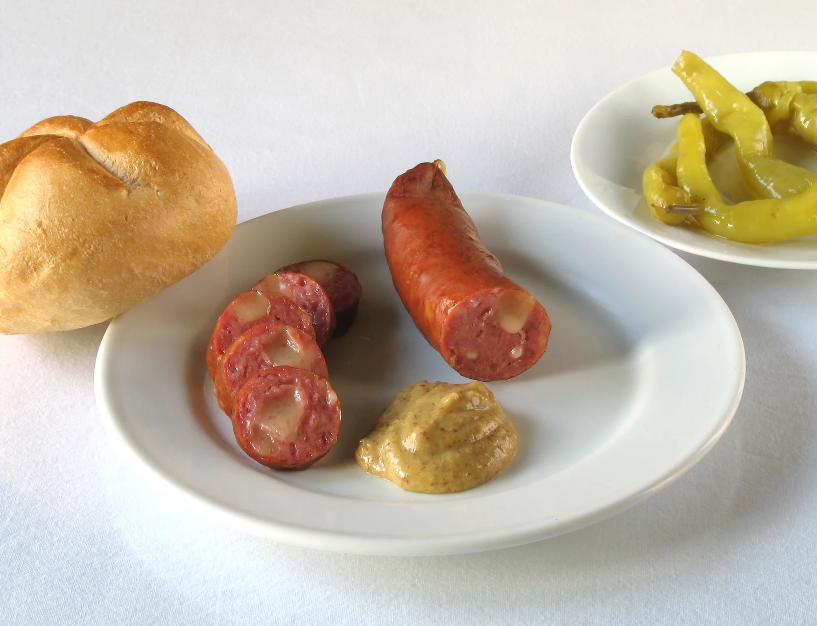 Traditional Käsekrainer sausage displaying its natural casing and rich texture.
