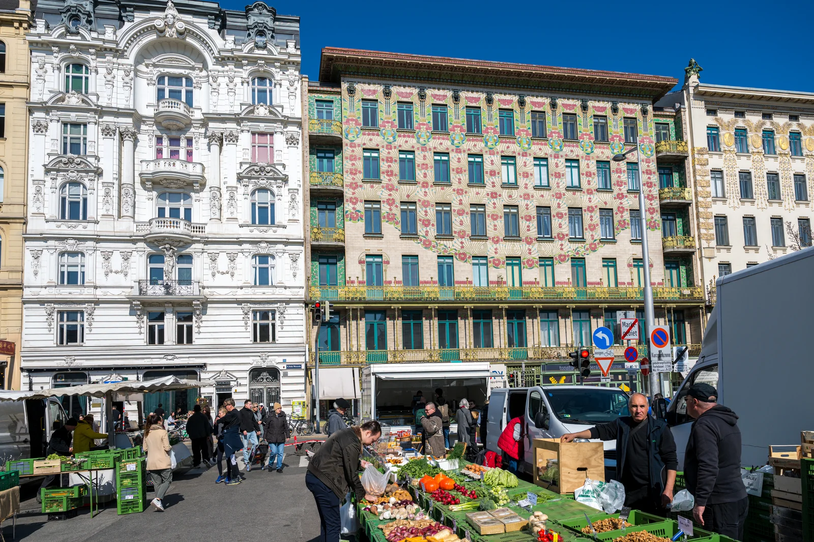Vibrant market stall loaded with fresh fruits, vegetables, and gourmet foods.