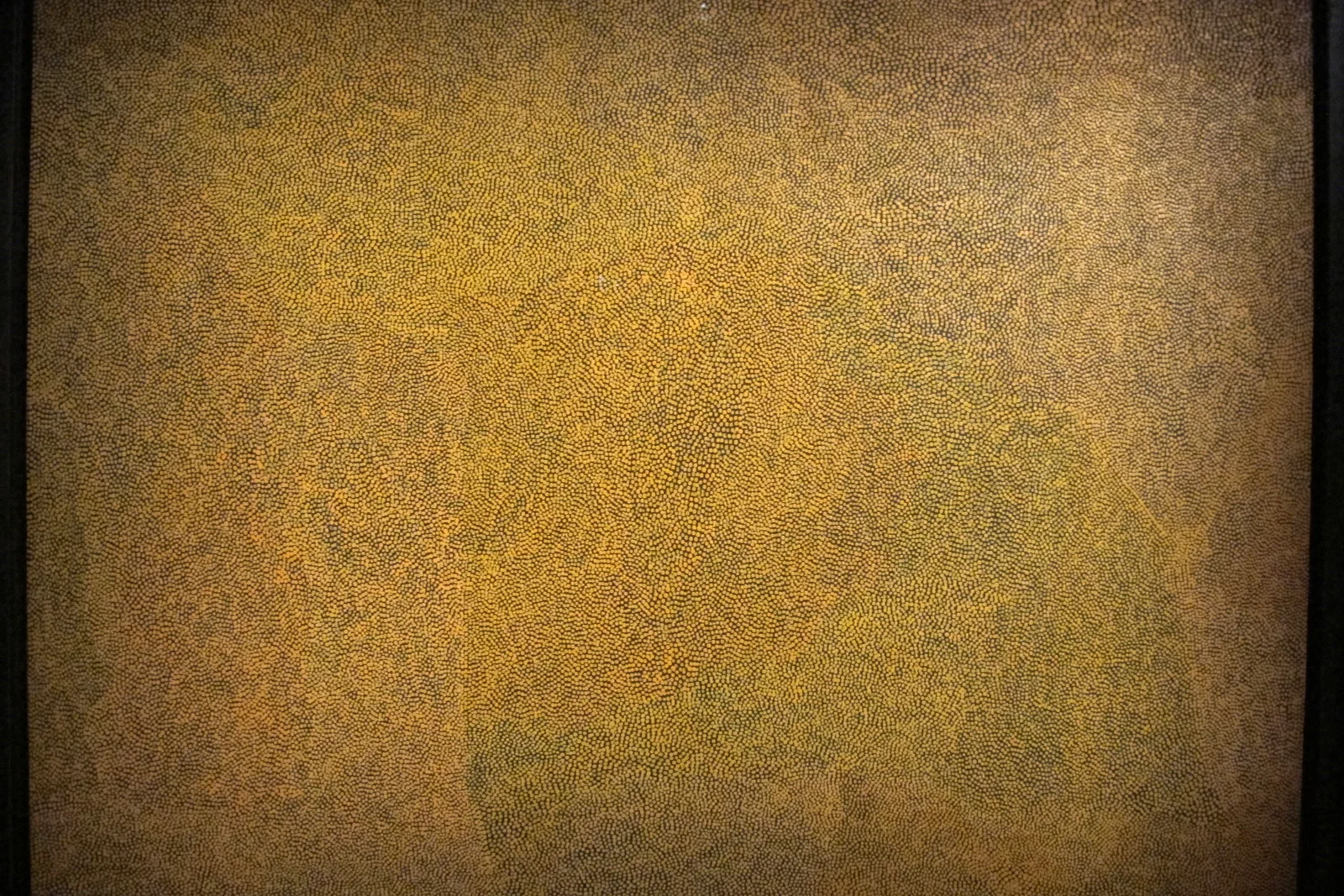 Desert acrylic painting on canvas showing delicate linear dot patterns in earthy ochre tones.