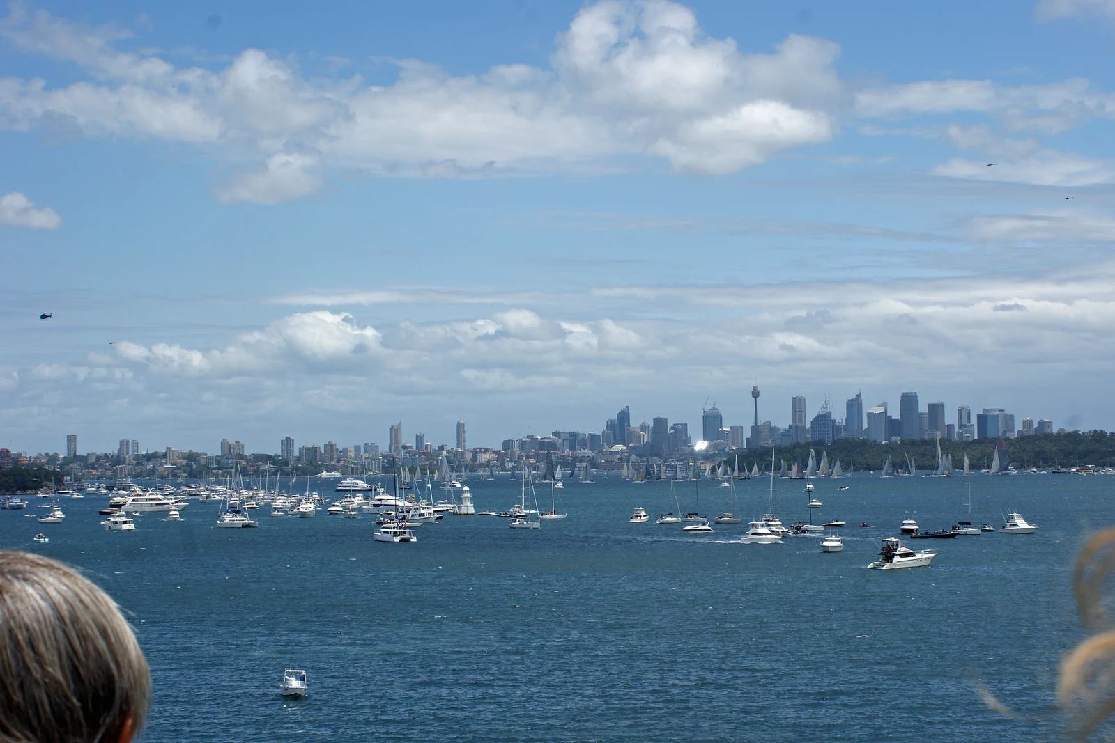 Fleet of racing sailing yachts and spectator boats in Sydney Harbour on Boxing Day.