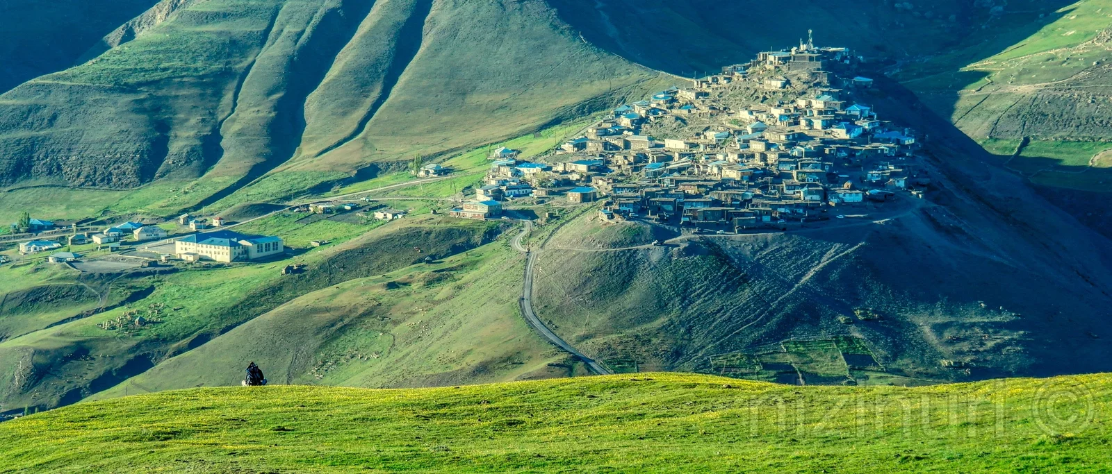 Stepped stone dwellings of Khinalig village terraced along high mountain ridges in the Greater Caucasus.