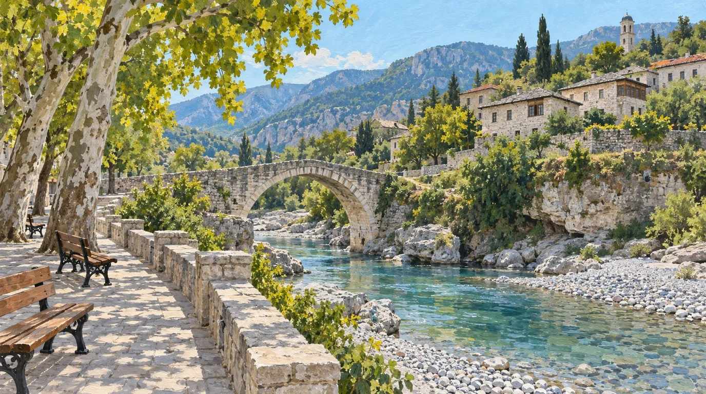 A monumental stone arch bridge spanning a wide emerald river between steep rocky banks under bright daylight.