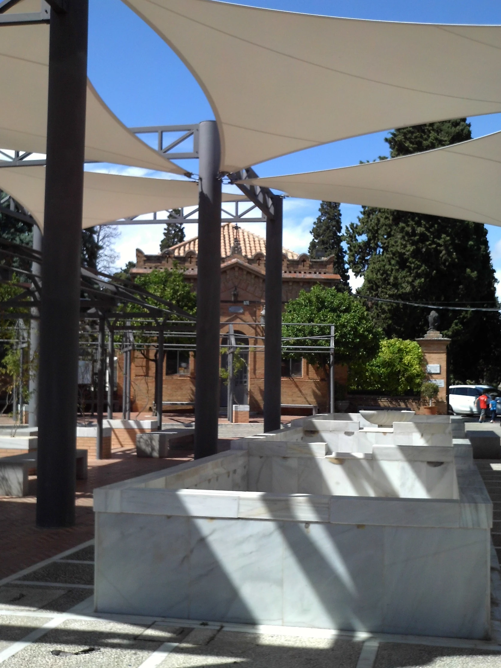 Traditional Sevillian domestic patio courtyard fitted with overhead canvas toldos.