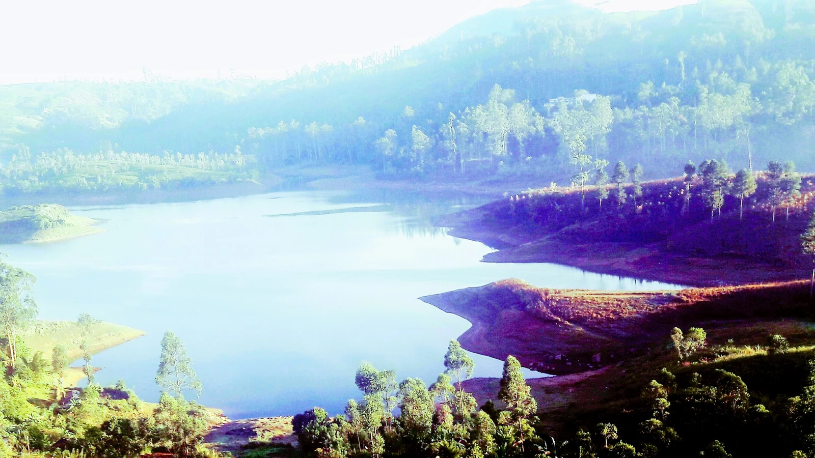The concrete gravity wall of Castlereagh Dam impounding headwaters in the Kehelgamu valley.