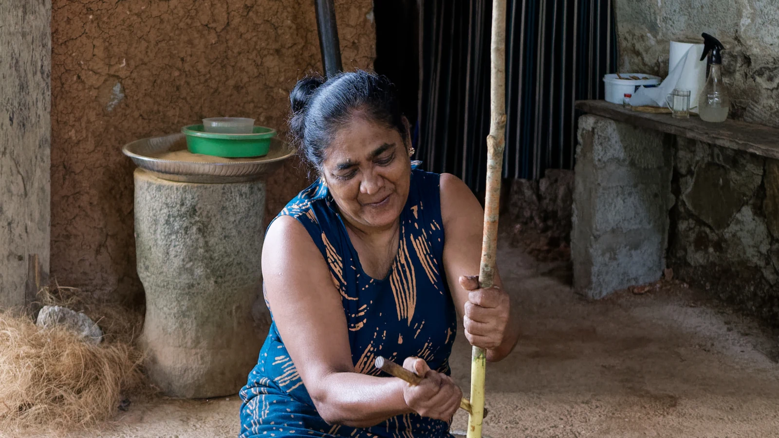 Artisan peeling the delicate inner bark of Ceylon cinnamon stems in Balapitiya.