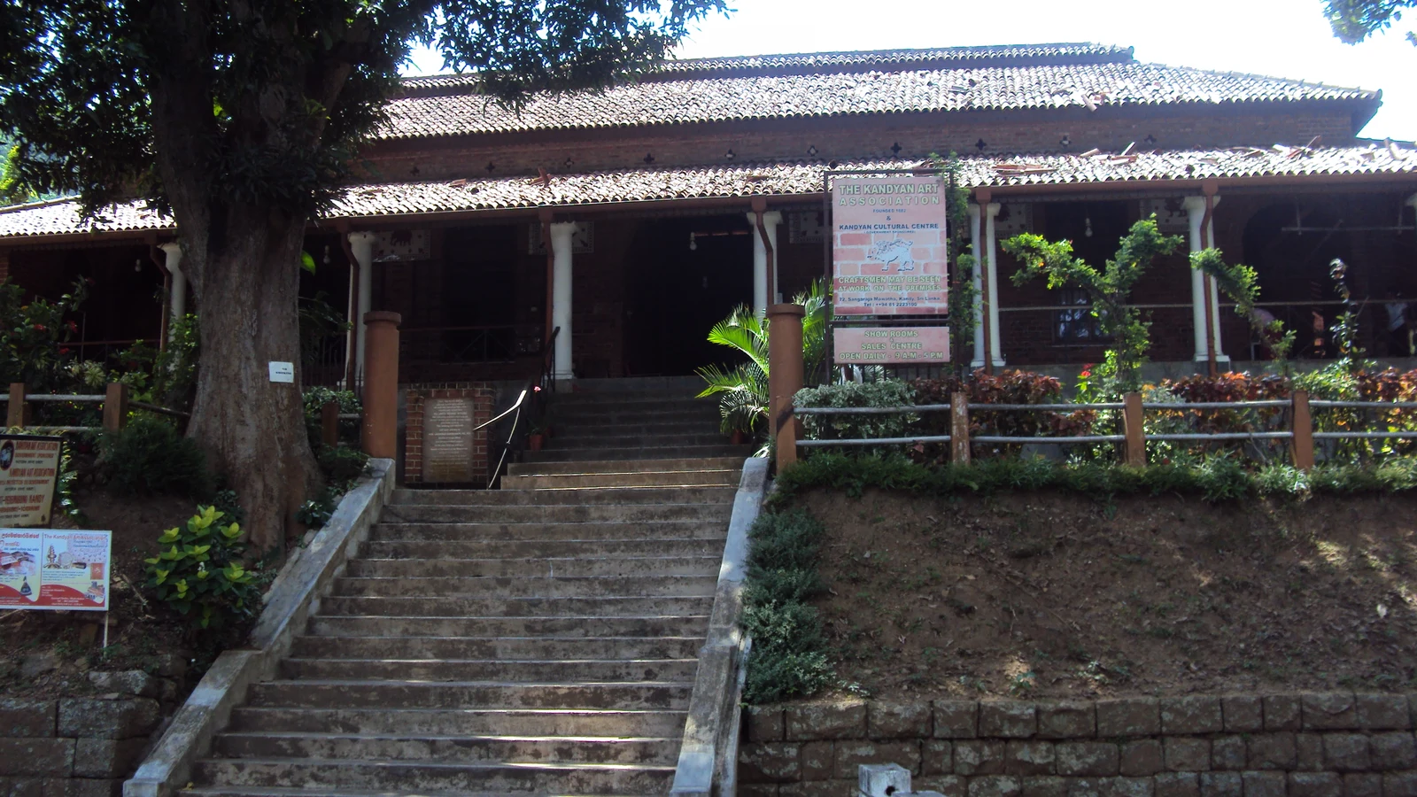 Exterior view of the historic Kandyan Art Association heritage building by the shores of Kandy Lake.