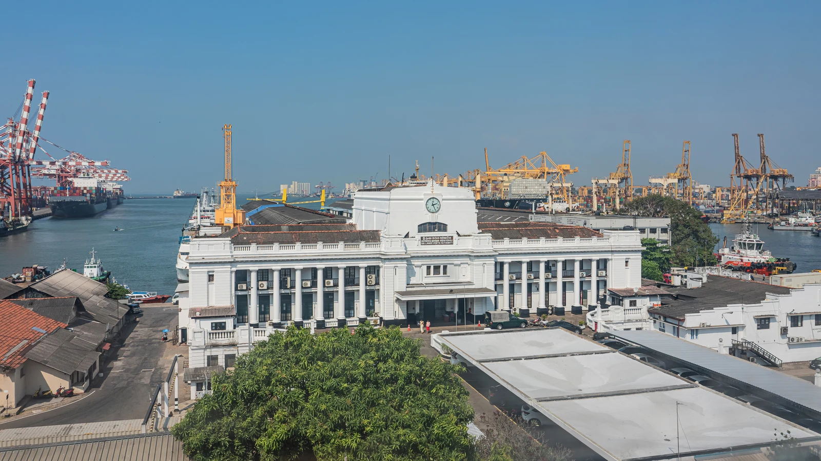 Gantry cranes and container handling berths along the commercial quays of the Port of Colombo.
