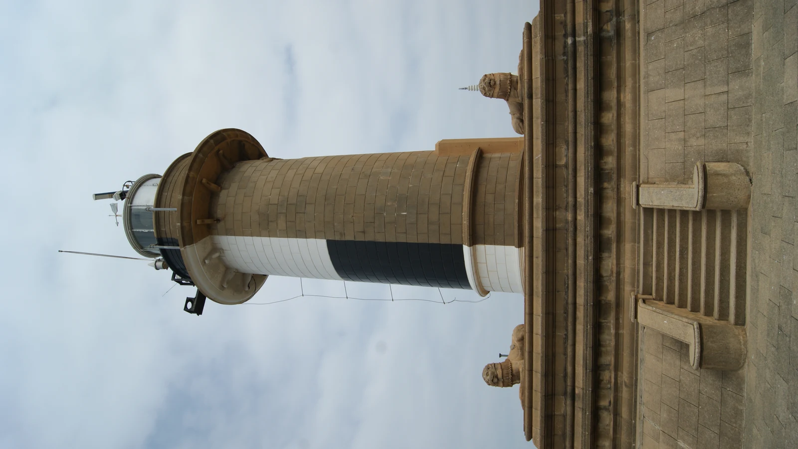 The historic Colombo Port Lighthouse standing watch over the harbor breakwater.