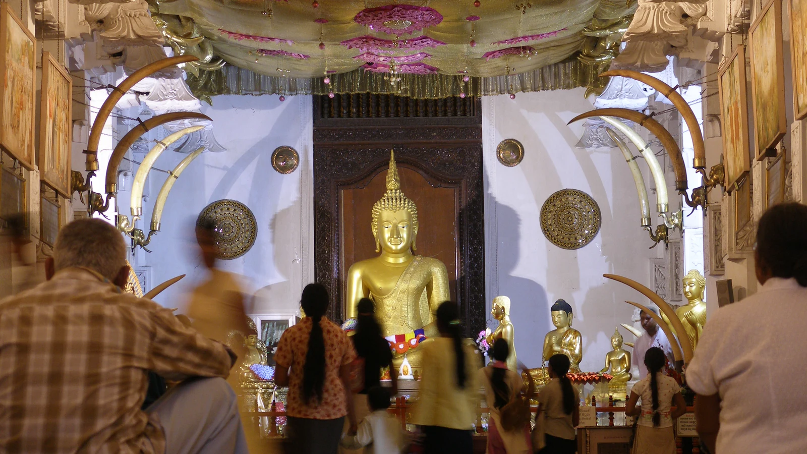 Carved timber architecture and stone gateways of Sri Dalada Maligawa.