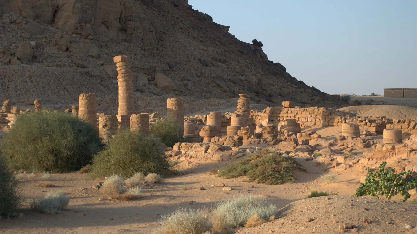Remains of massive sandstone columns and stone foundations at the Temple of Amun at the base of Jebel Barkal.