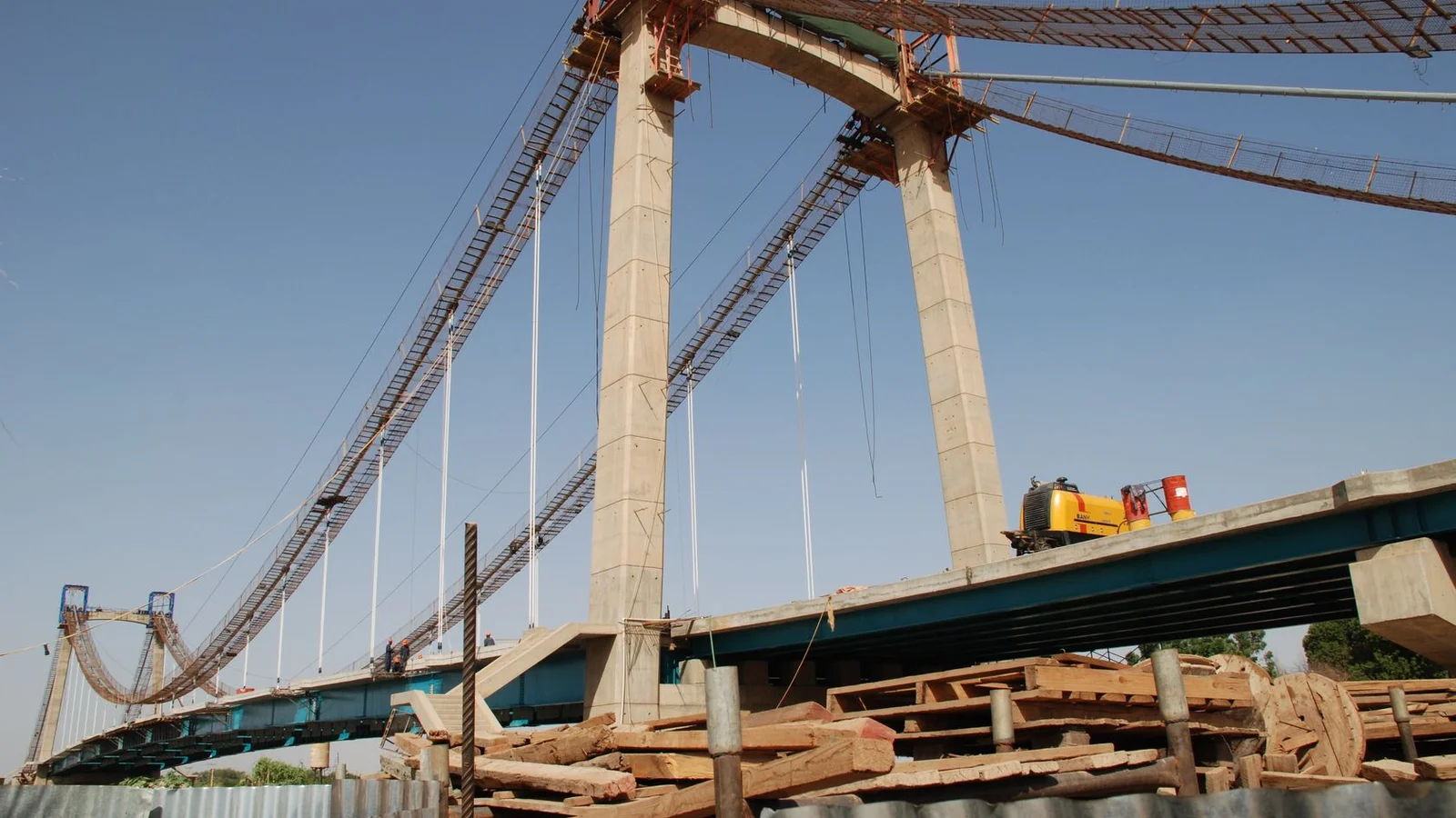Modern cable-stayed suspension bridge connecting Khartoum to agricultural Tuti Island across the Blue Nile.