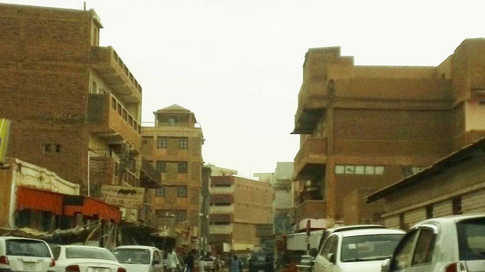 Traditional market stalls displaying sacks of provisions and goods in Souq Omdurman.