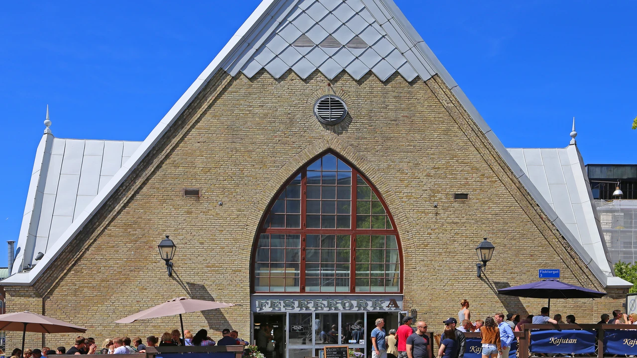 Fresh seafood displays and fishmonger counters inside Feskekôrka market hall.