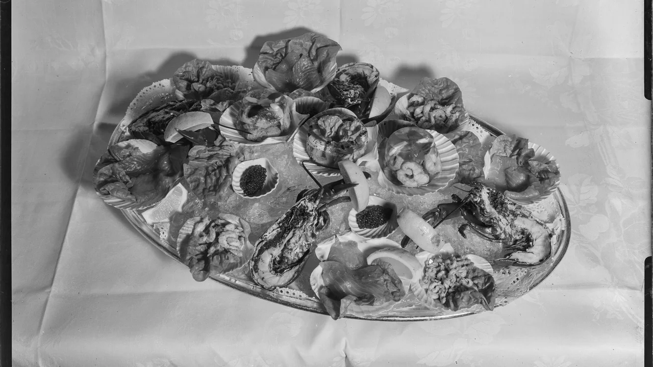 Historical archival presentation of curated Swedish culinary dishes and table service from the Nordiska museet collection.