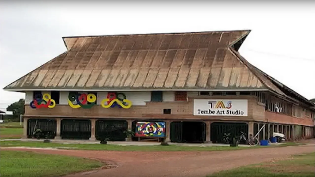 The exterior of Tembe Art Studio in Moengo, featuring traditional Maroon geometric motifs along its facade.
