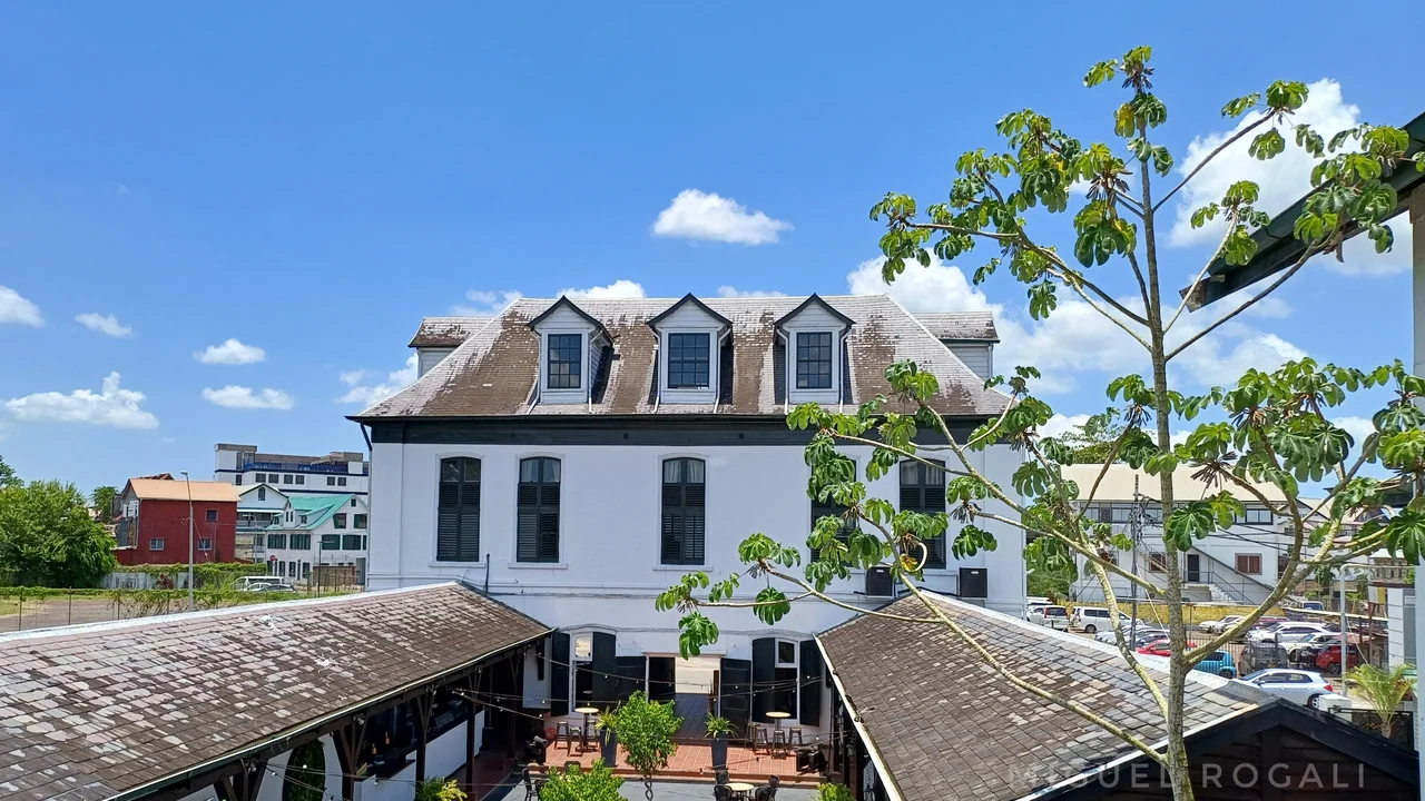 The historic De Waag weighing house building and courtyard along the Waterkant in Paramaribo.