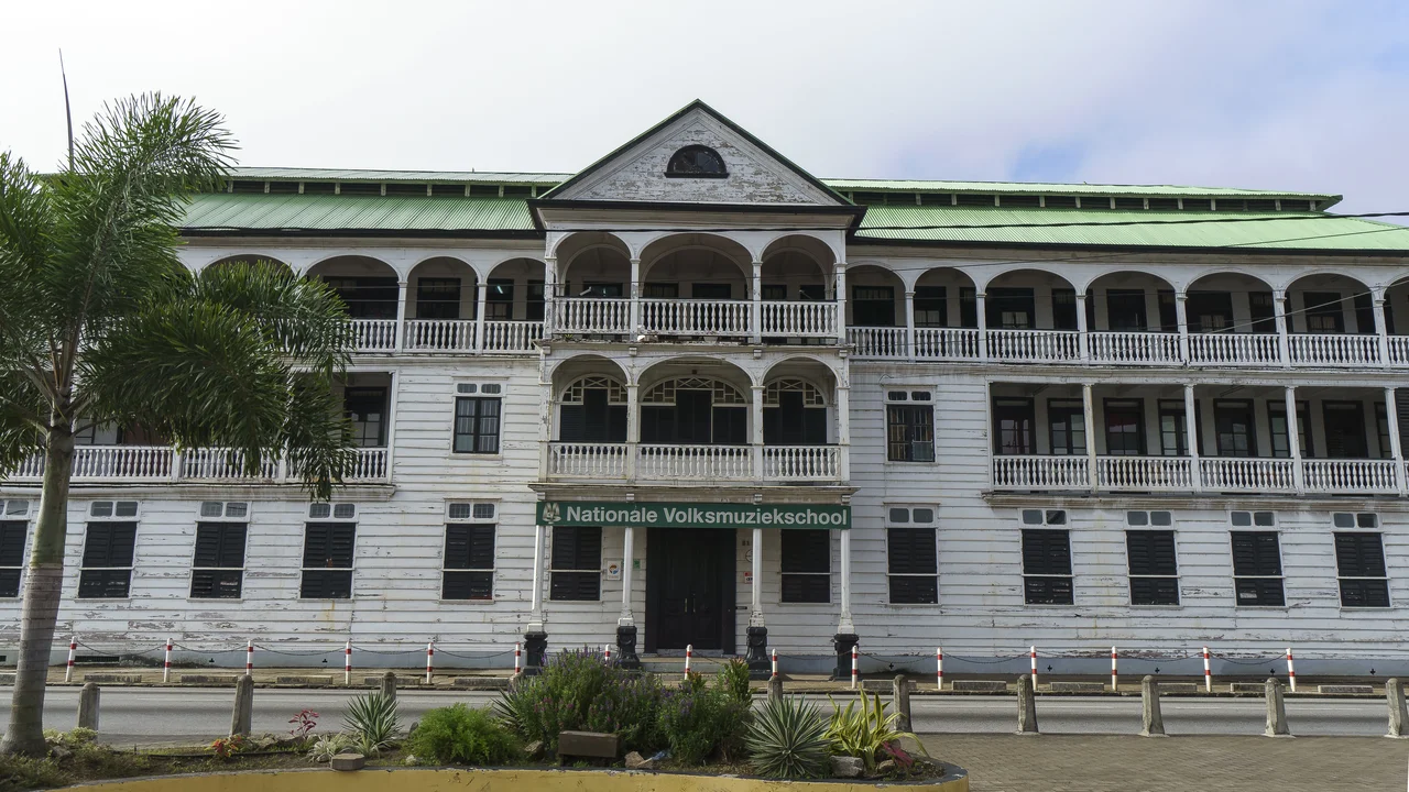 Classical white timber government administration and ministerial buildings along the historic center of Paramaribo.